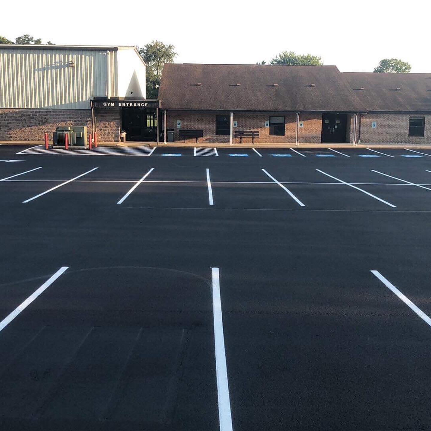 Commercial parking lot in the Seattle area after fresh asphalt sealcoating